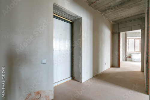 interior of the apartment without decoration in gray colors. rough finish © gluschenkoart