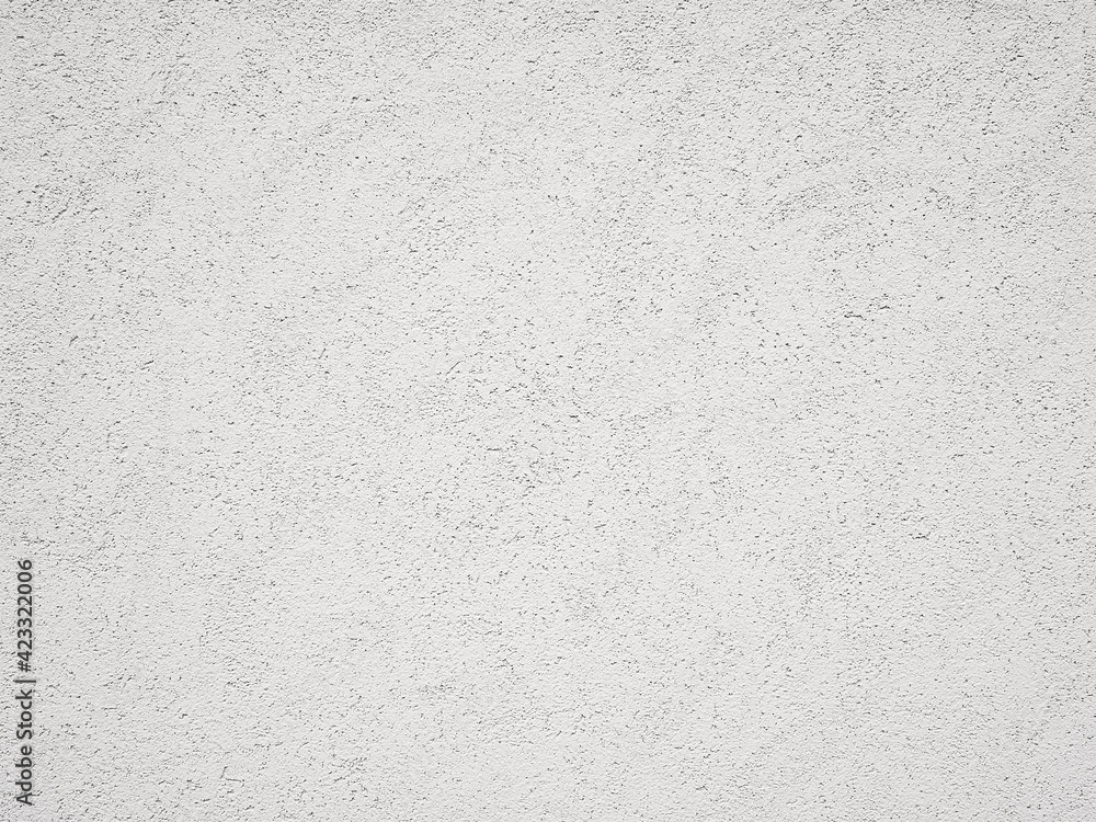 ザラザラの質感のある白い壁の背景テクスチャー