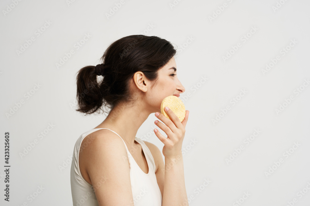 pretty woman in tank top cosmetics skin care makeup remover sponge pretty woman in tank top cosmetics skin care makeup remover sponge