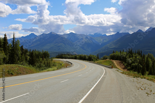 Highway running through Alaskan landscape