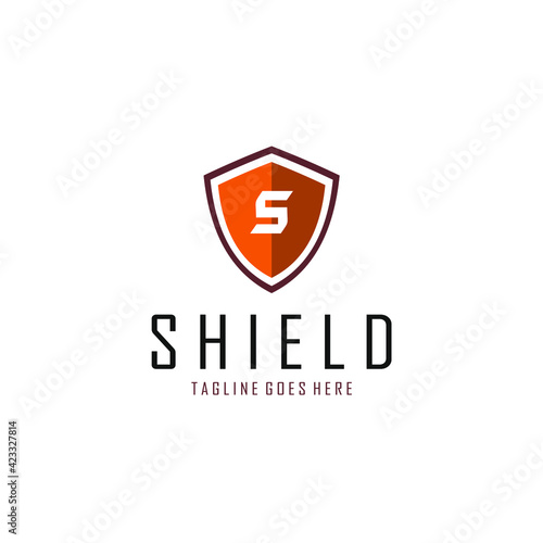 the letter S logo in the middle of the brown shield