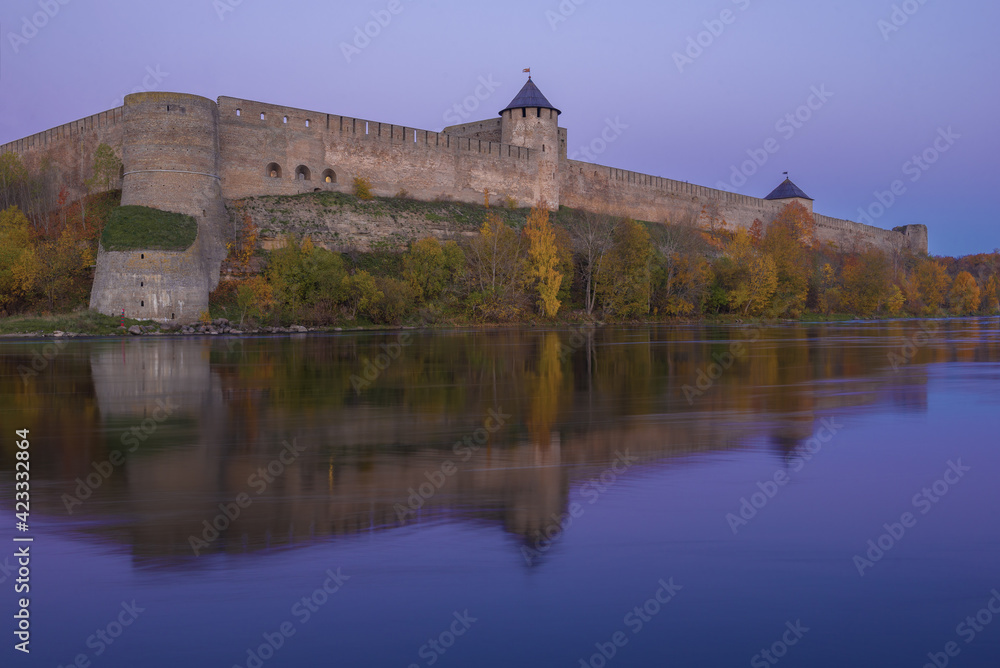 Ivangorod fortress in lilac October twilight. Leningrad region, Russia