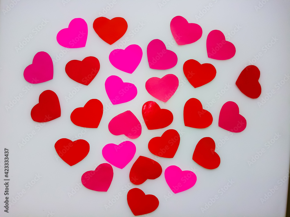 paper hearts lined in the shape of a big heart