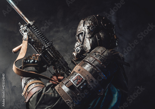 Photo Survivor with custom armour and gun in dark background