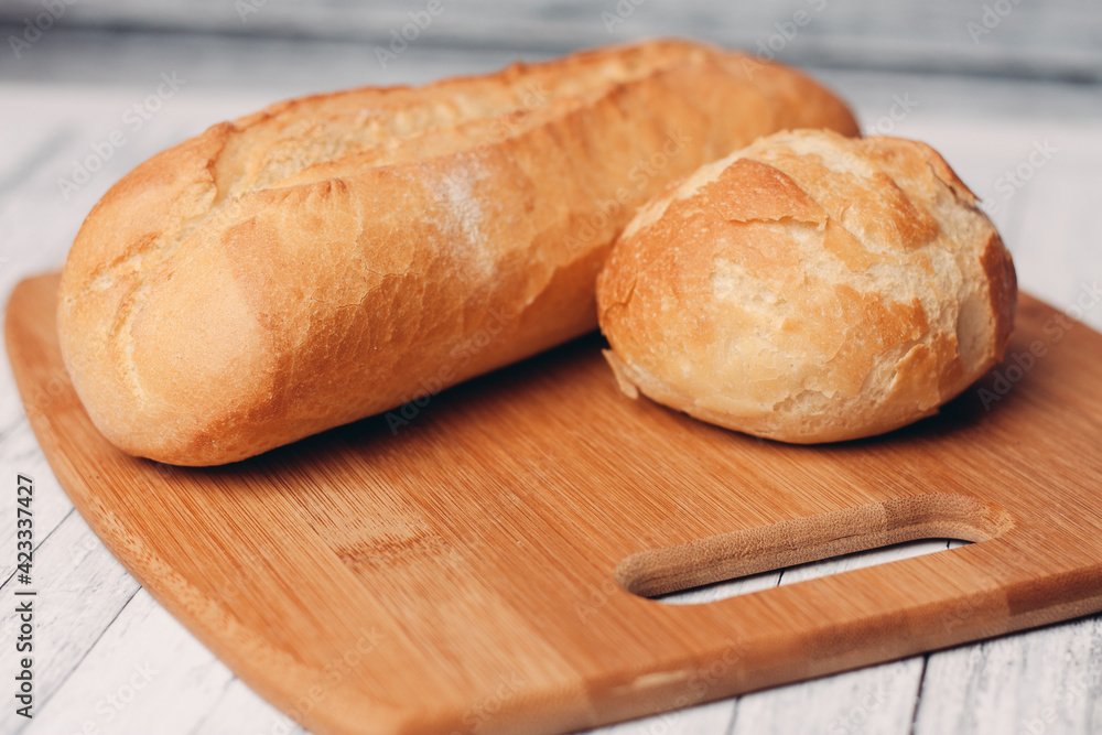 loaf with bun fresh baked goods home cooking wood board fresh flavor loaf with bun fresh baked goods home cooking wood board fresh flavor