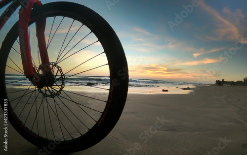 bicycle on the beach at sunset © Kabir
