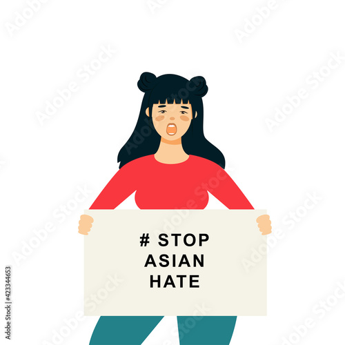 Stop Asian Hate‬‬. Hashtag to support asian community during the covid-19 pandemic. Stop racism. woman wearing protective face mask and holding banner against bullying, hate and violence. photo