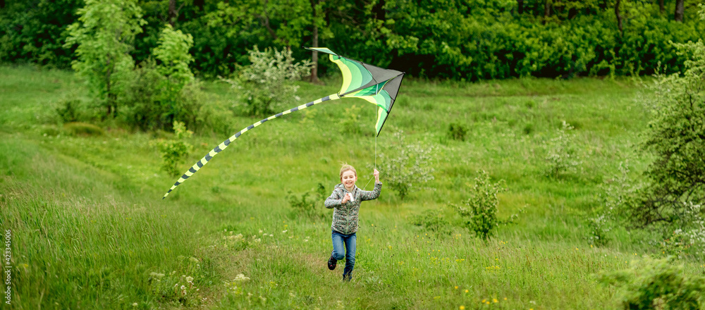 Happy little girl flying bright kite Happy little girl flying bright kite