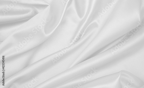 Smooth elegant white silk or satin luxury cloth texture as wedding background. Luxurious background design