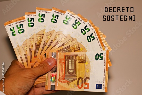 hand holding banknotes of 50 euros photo