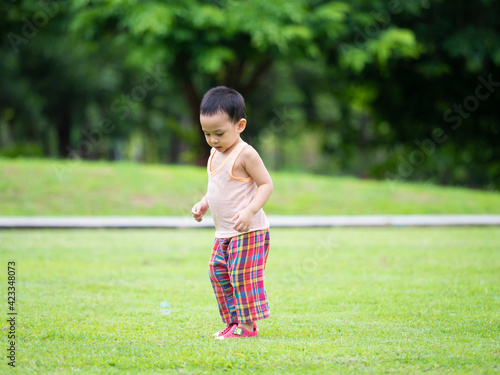 Close up shot of cute asian child in playing activity
