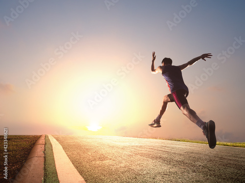 a man as athlete runner in high speed running action on the road