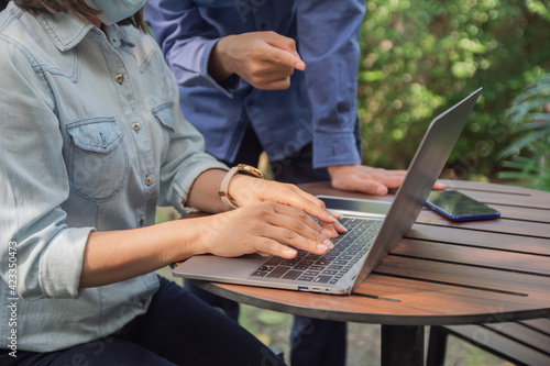 people use computer notebook work freelance in cafe, Man explain women on computer