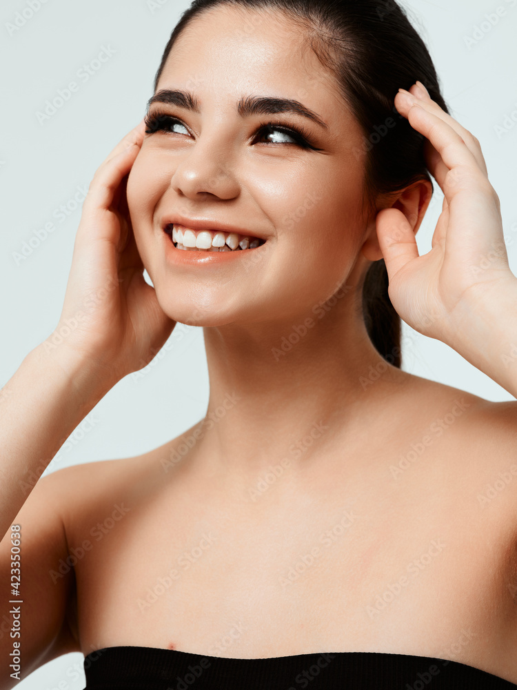 happy woman in black dress gesturing with hands and smiling happy woman in black dress gesturing with hands and smiling
