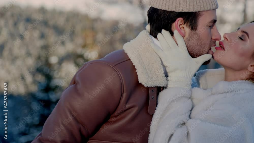 couple kissing on a background of mountains couple kissing on a background of mountains