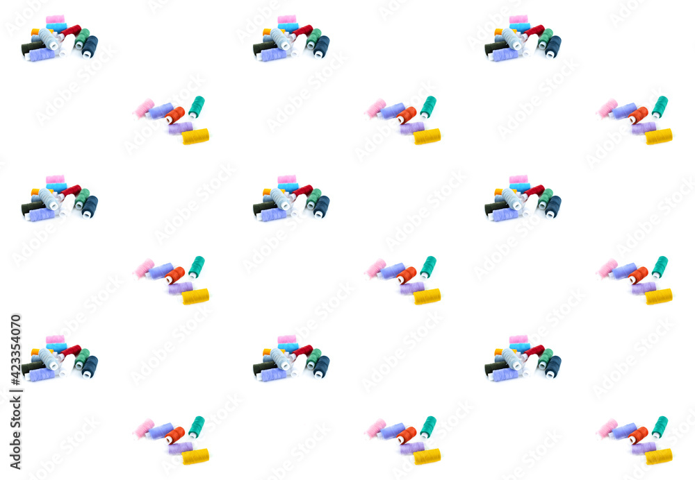 set of colored threads on a bobbin material for embroidery on a white isolated background set of colored threads on a bobbin material for embroidery on a white isolated background