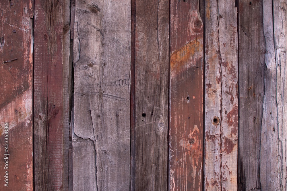 The background is made of wooden panels. Old vintage board texture. The background is made of wooden panels. Old vintage board texture.