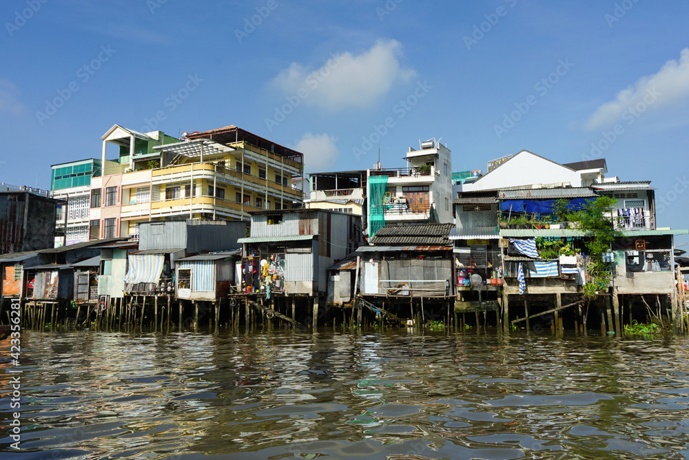 Houses standing on pillars in the Mekong river, Vietnam Houses standing on pillars in the Mekong river, Vietnam