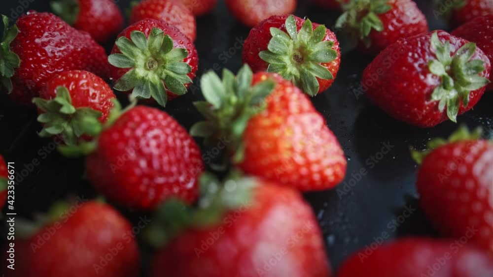 Strawberries on a black background. Natural products are environmentally friendly. Macro shot Strawberries on a black background. Natural products are environmentally friendly. Macro shot