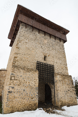 A Fortification Tower With a Gate to the Citadel is Facing the Last Snow of the Winter