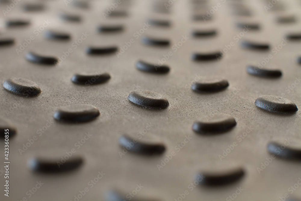 A background of bulging pimples. Plastic shoe tray. Background with gray raised details. Bulging oval elements A background of bulging pimples. Plastic shoe tray. Background with gray raised details. Bulging oval elements
