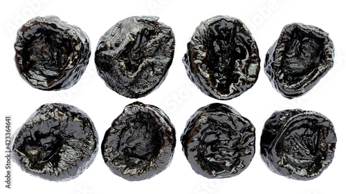 Prunes isolated on white background  top view. Set of dry prunes isolated on white background. Dry prunes set on white background  top view. Dry plum isolated on white background  top view.