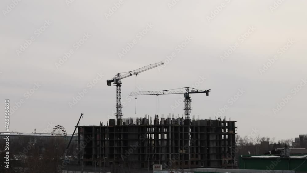 Silhouettes Of Working Construction Cranes - Timelapse Silhouettes Of Working Construction Cranes - Timelapse