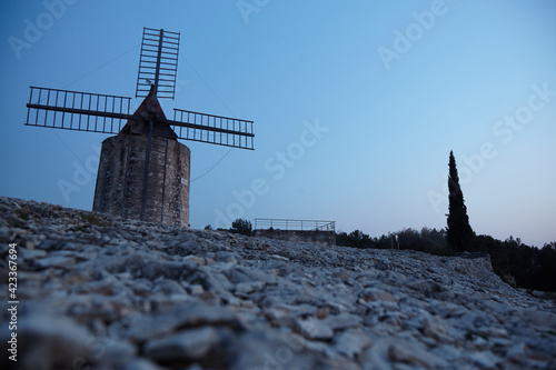 Mill of Daudet/Provence/France in the blue hour. Van Gogh has painted this motive. Today there are the new energies. Sustainability. photo