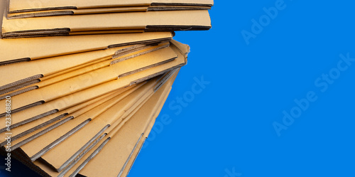 Stacking of cardboard boxes, Corrugated paper on blue background.