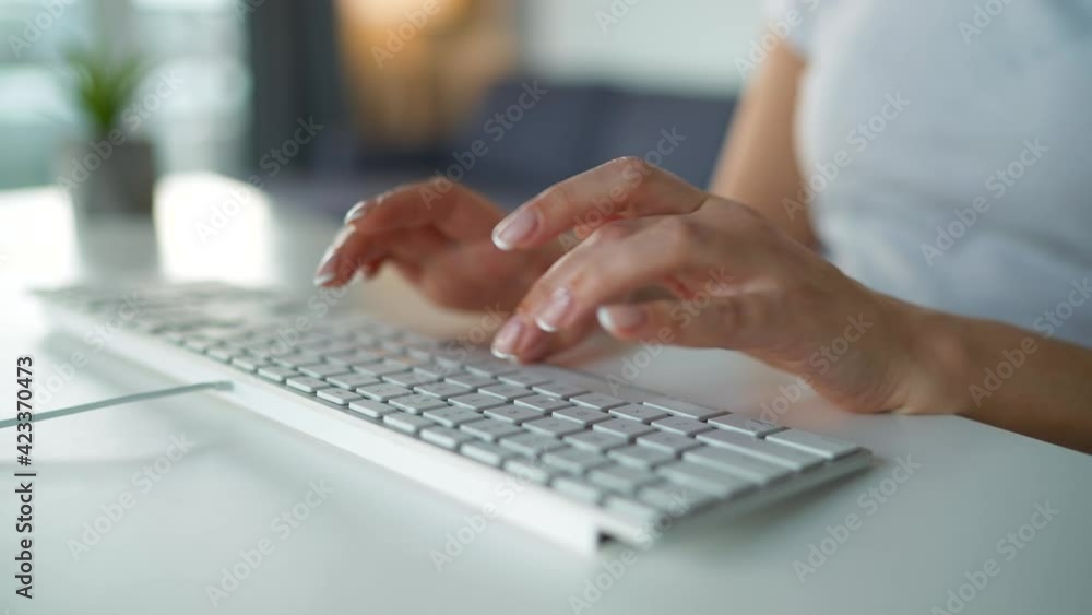Female hands typing on a computer keyboard. Concept of remote work. Female hands typing on a computer keyboard. Concept of remote work.