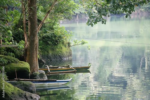 landscape on the lake, philippine islands / tropical volcano lake with a floating house