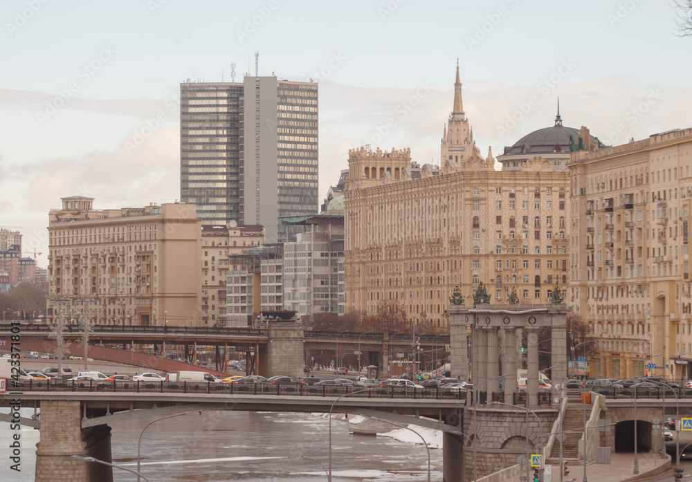 Obraz premium Moscow, Russia. Winter view of Smolenskaya embankment, Moscow city hall, bridges. Shot at telephoto lens