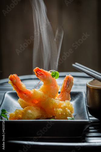 Golden shrimp in tempura with sauce. Old Chinese cuisine.