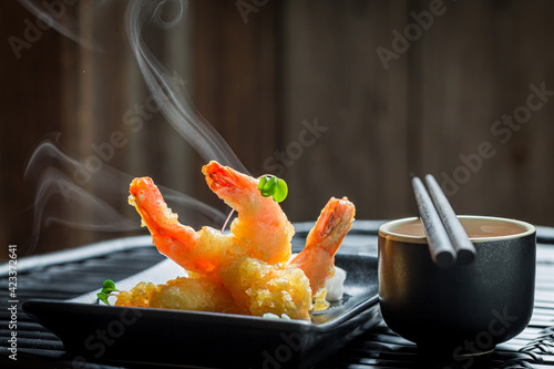 Shrimp in tempura served with red sauce. Chinese cuisine.