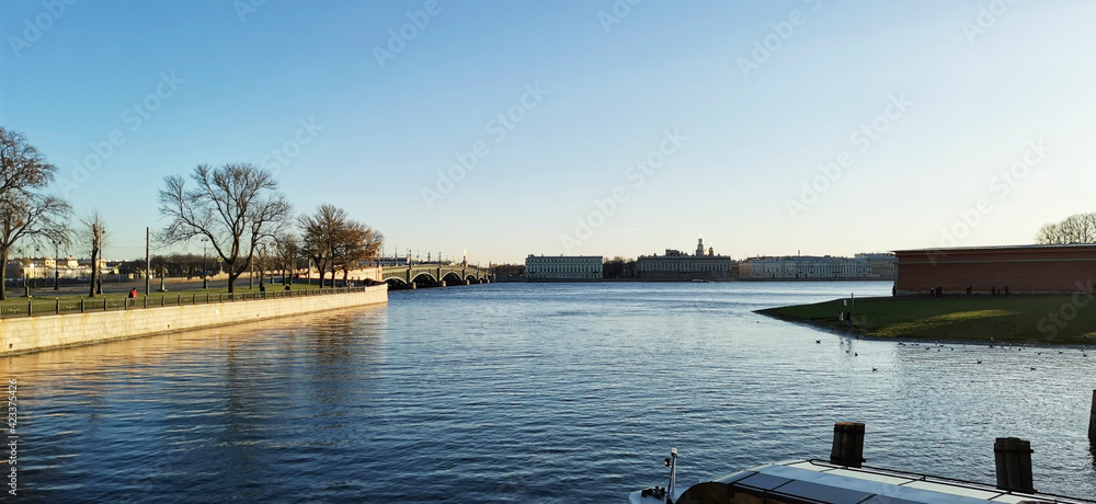 St. Petersburg, Russia - November 8, 2020: View of Troitsky bridge and Palace embankment in St. Petersburg on a sunny autumn day St. Petersburg, Russia - November 8, 2020: View of Troitsky bridge and Palace embankment in St. Petersburg on a sunny autumn day