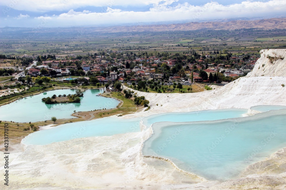 snow-white mountain pamukkale in turkey. healing water in pools and salt baths. white mountain landscape