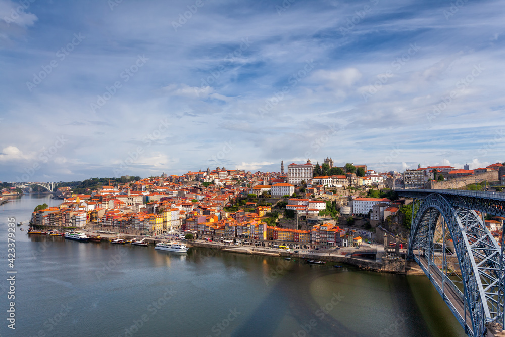 Oporto, Portugal, Europe. Postcard from the picturesque city of Porto, amazing travel destination in Portugal. View to the historic center, Douro River with its beautiful bridge and old monuments.