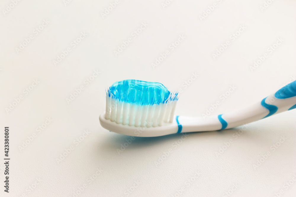 A brush for brushing your teeth with blue toothpaste. A brush for brushing your teeth with blue toothpaste.
