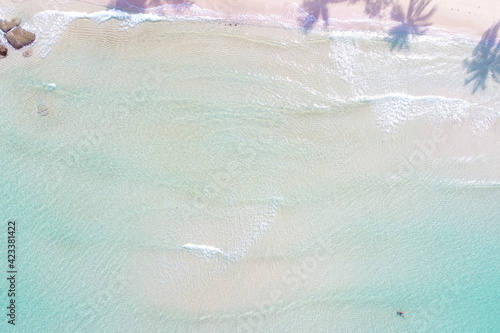 Aerial view azure sea water white sand beach with coconut shadow