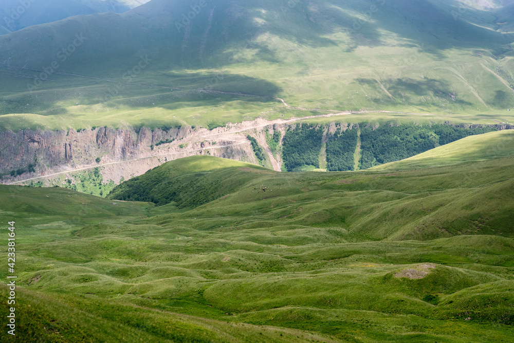 Caucasian landscape. View of Malka river canyon and road going along it. Prielbrusye National Park, Kabardino-Balkaria, Caucasus, Russia..