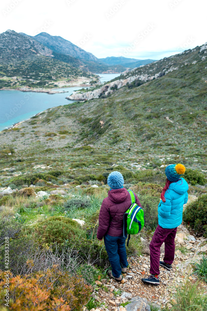 two girls travel together.