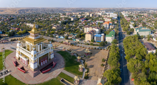 Panoramic aerial view of Golden Temple of Buddha Shakyamuni and Lenin street on sunny day. Elista, Kalmykia, Russia.