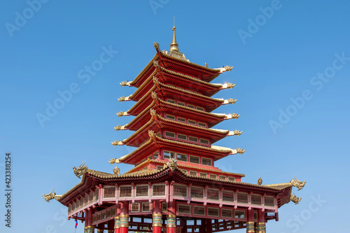View of Seven Days Pagoda on Lenin square on sunny summer day against blue sky. Elista, Kalmykia, Russia.
