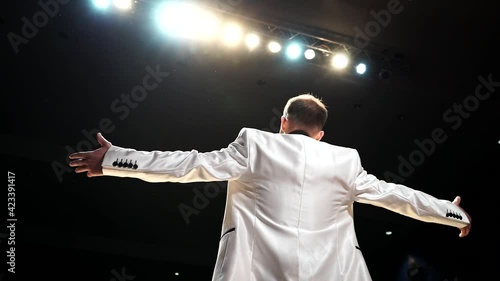 the artist on stage greets the audience