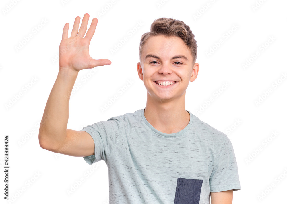 Handsome teen boy laughing looking very happy, isolated on white background. Handsome teen boy laughing looking very happy, isolated on white background.