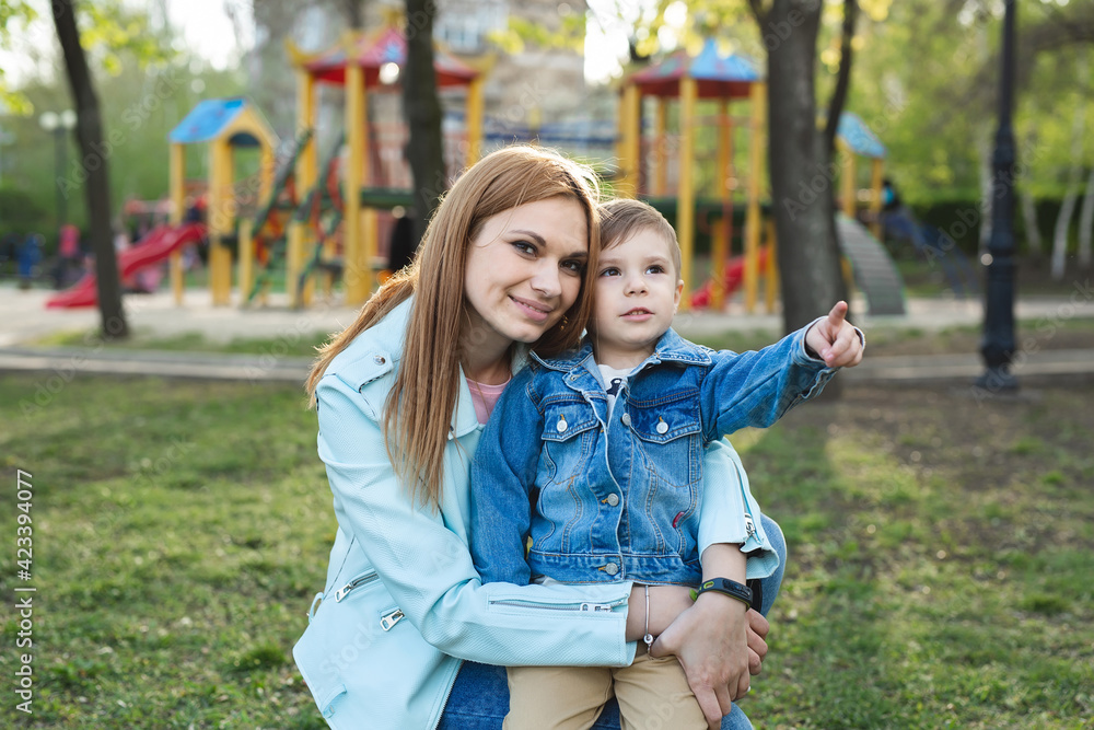 Portrait of mother and son in the park in the spring. Portrait of mother and son in the park in the spring.