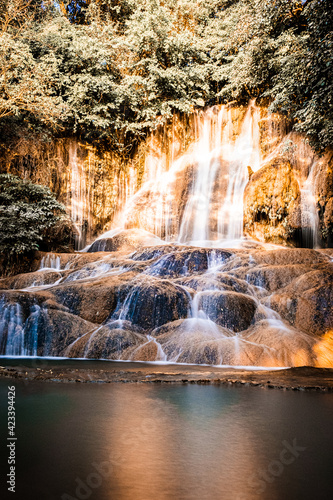 A small waterfall in the mountain cave rocks