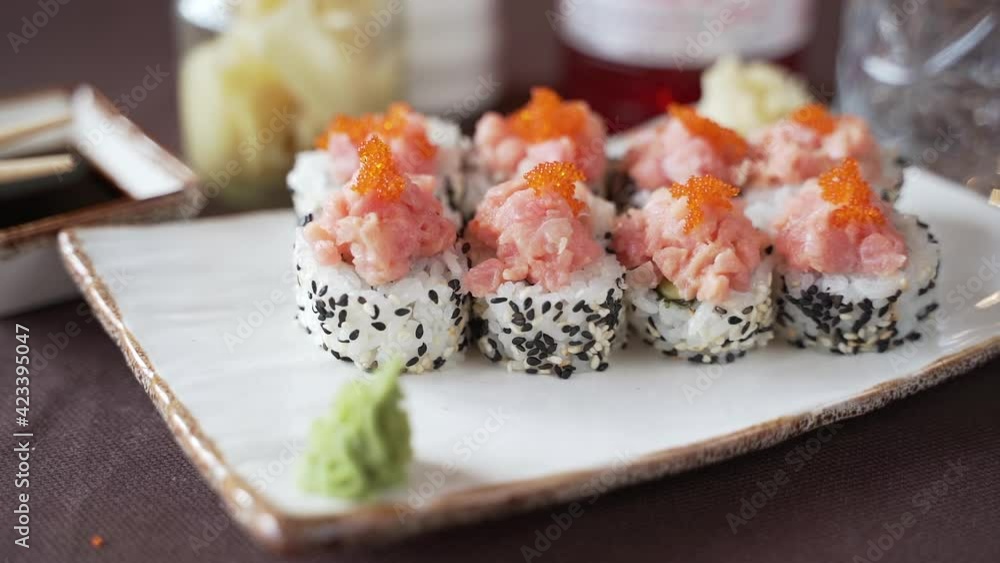 Sushi set with red caviar, beautifully presented on the table Sushi set with red caviar, beautifully presented on the table