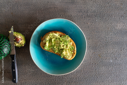 Overhead view of ripe avocado toast on a plate