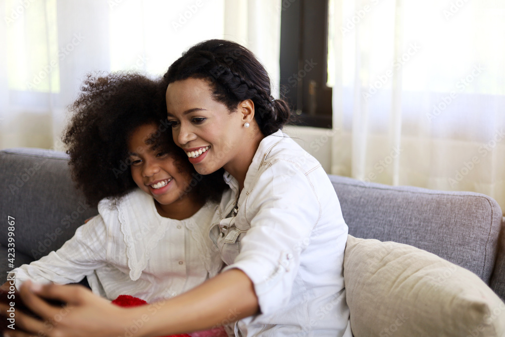 American kid girl smile portrait and selfie photo with mother at home. American kid girl smile portrait and selfie photo with mother at home.